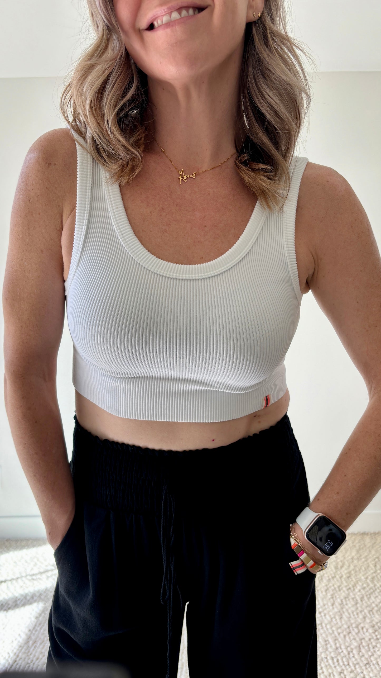 Women's white ribbed cropped stretch knit tank top with stripe label