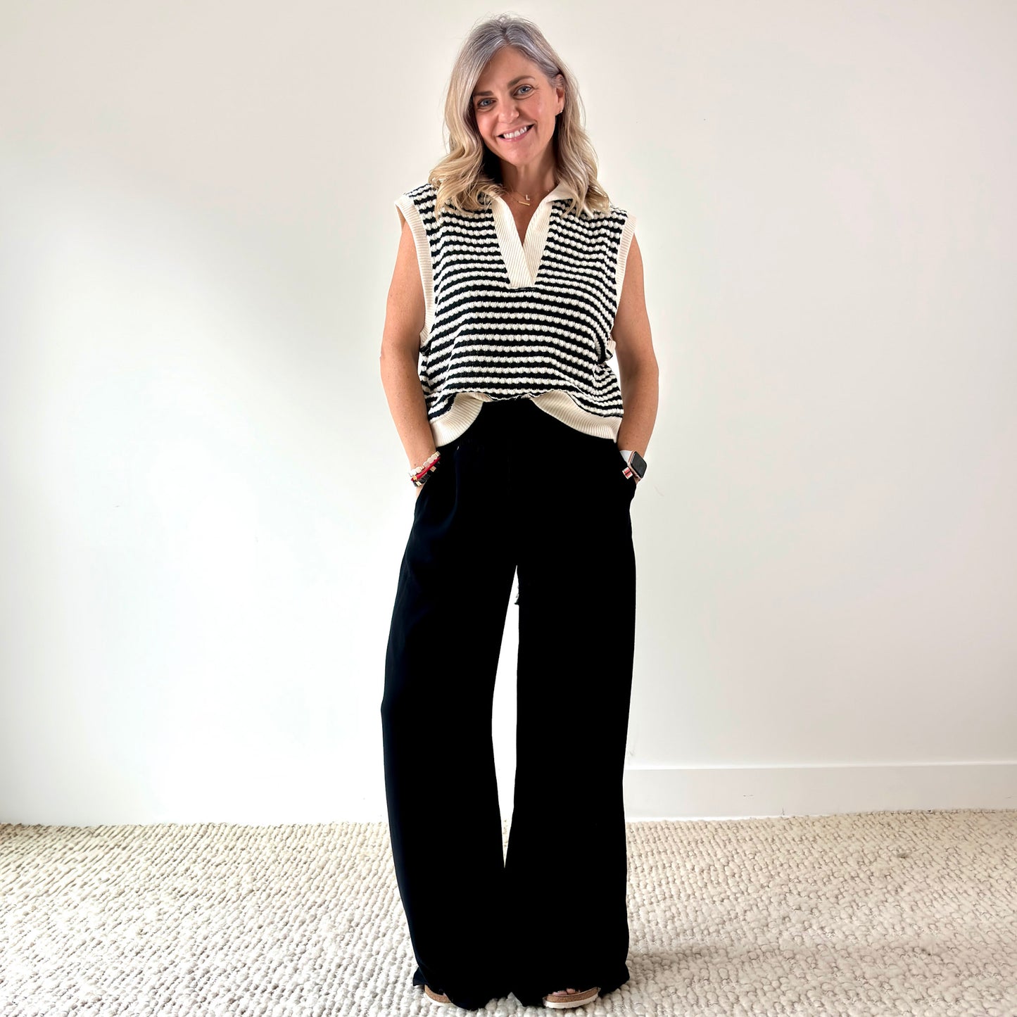 Women's black smocked waist wide leg pant with pockets and tassel drawcord