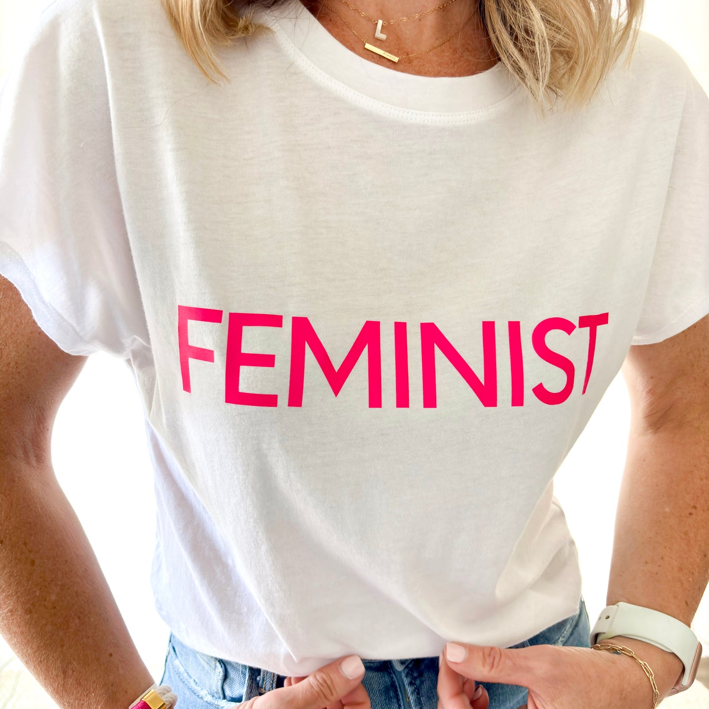 women's white short sleeve t shirt with neon pink feminist print