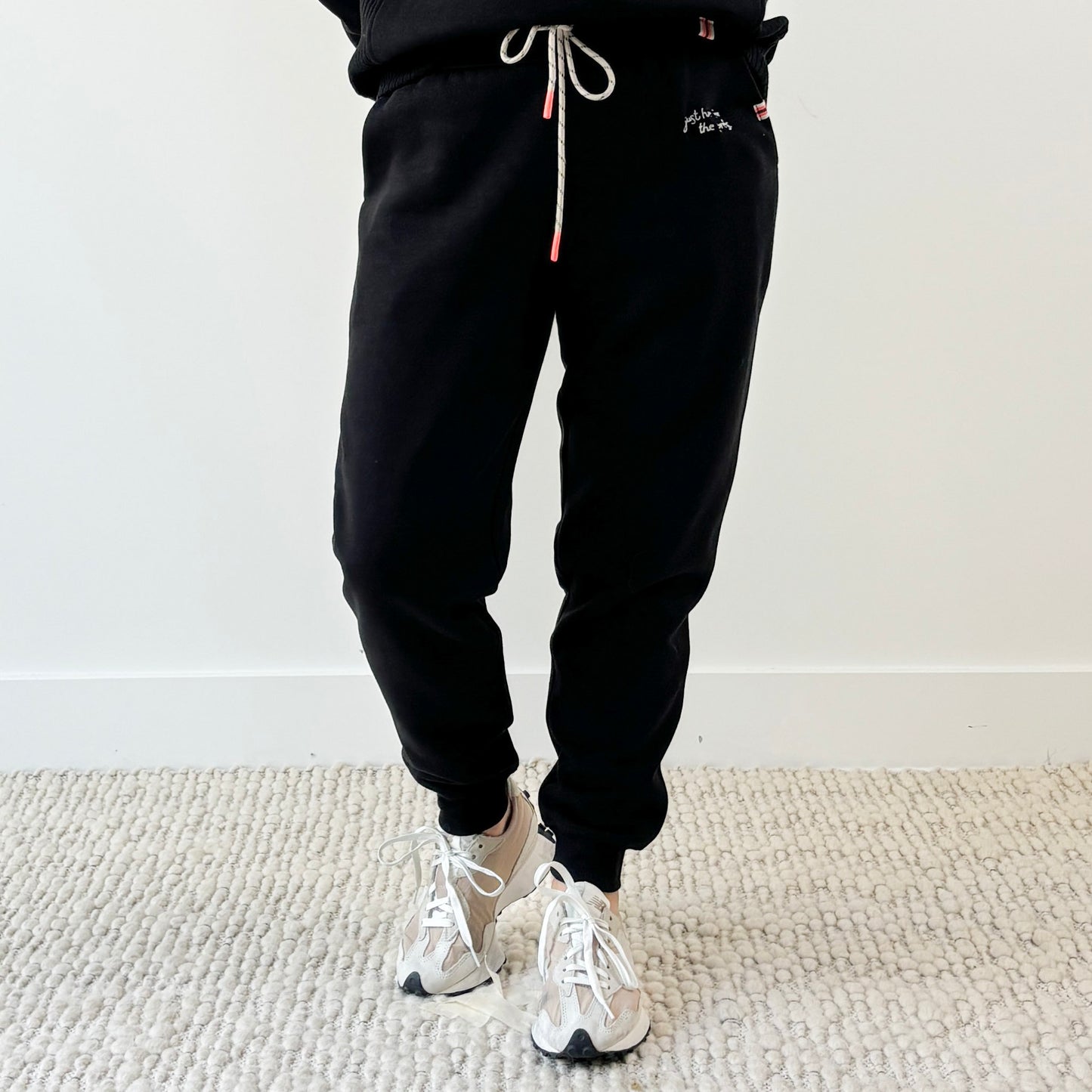 Women's black slim fit fleece jogger with just here for the après embroidery
