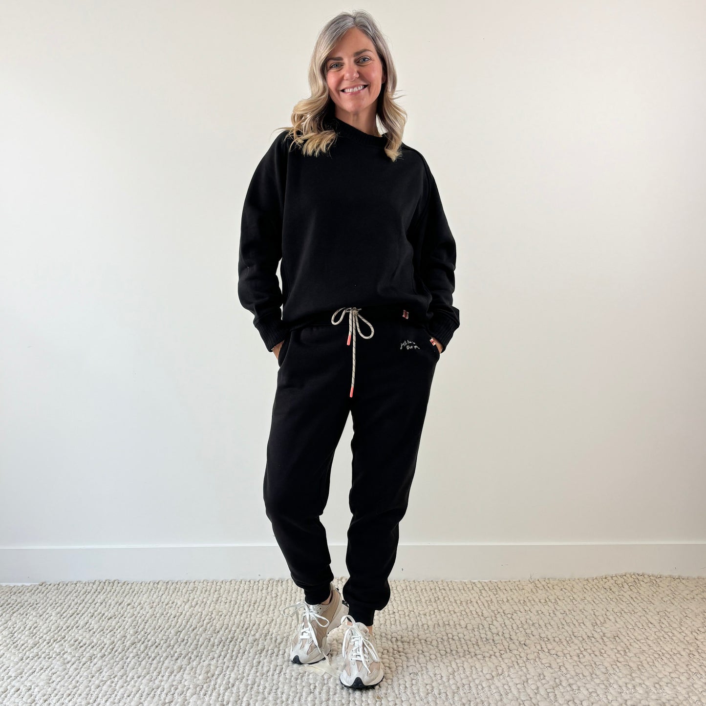 Women's Black Cozy Fleece Rib inset Crewneck Sweatshirt and Women's black slim fit fleece jogger with just here for the après embroidery