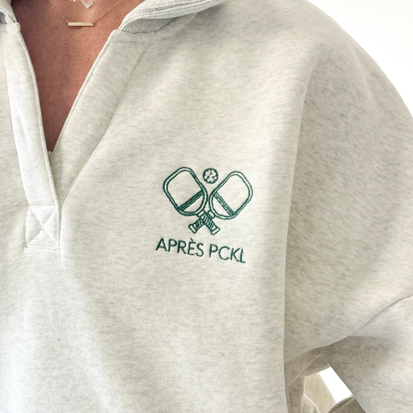 Heather oatmeal oversized collared sweatshirt with après pckl pickleball paddle embroidery