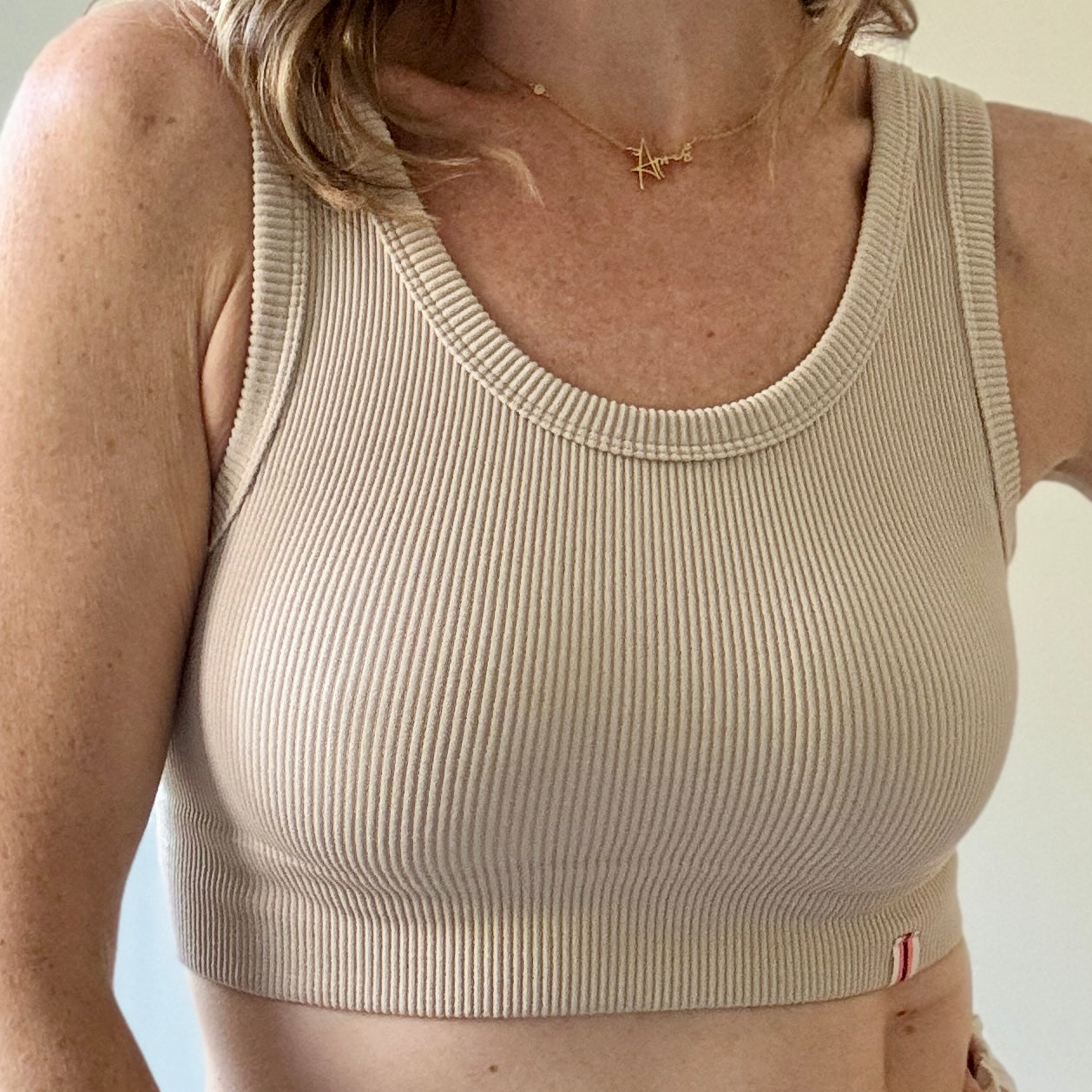 Women's tan ribbed cropped stretch knit tank top with stripe label