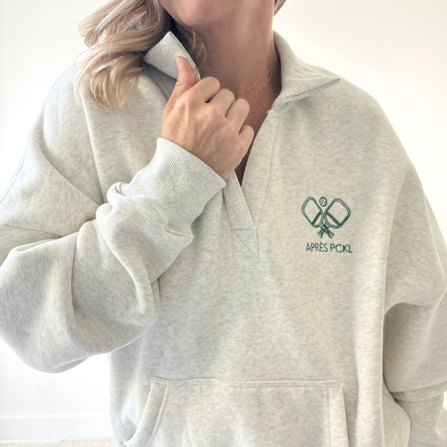 Heather oatmeal oversized collared sweatshirt with après pckl pickleball paddle embroidery