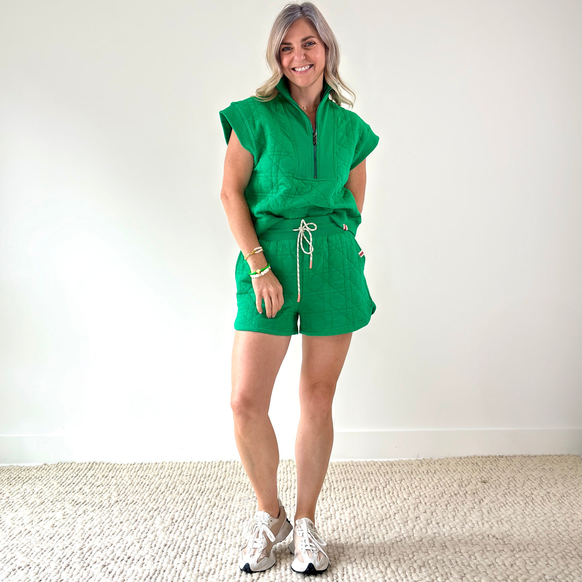Women's kelly green textured quart zip pull over top with rib trim
