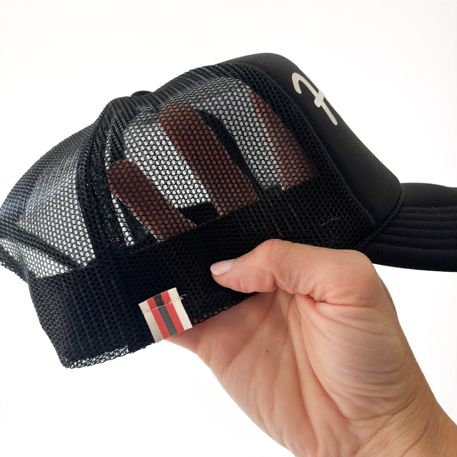 Black mid profile trucker hat with pearl script hooty hoo print