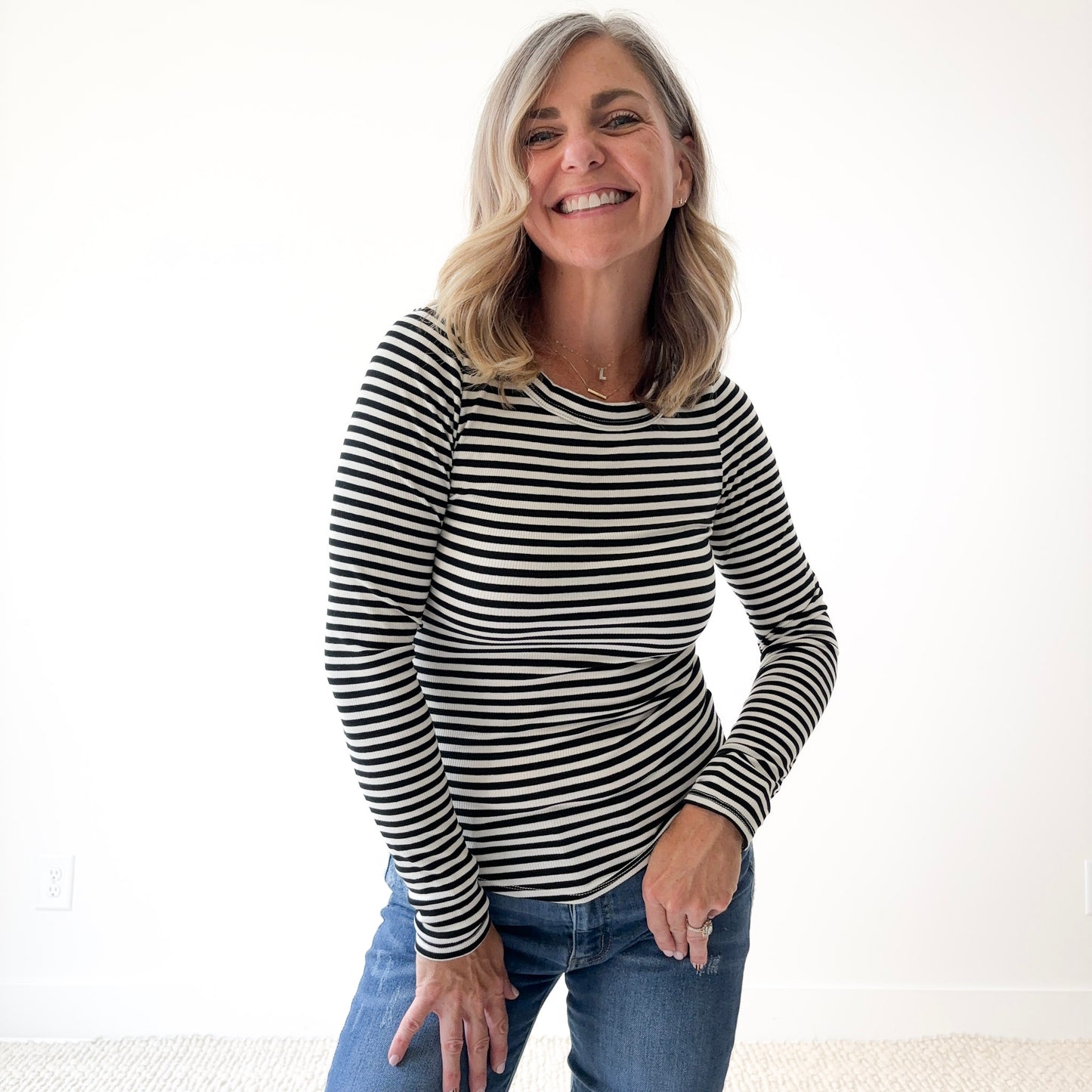Women's long sleeve fitted black and white stripe crew neck top