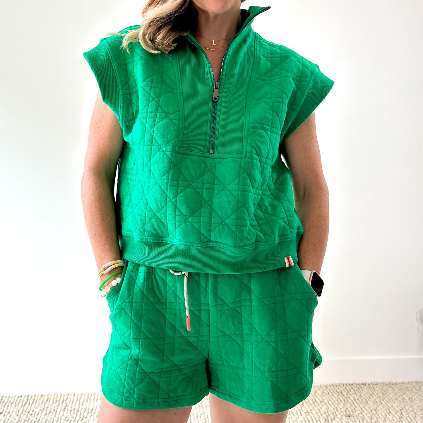 Women's kelly green textured quart zip pull over top with rib trim