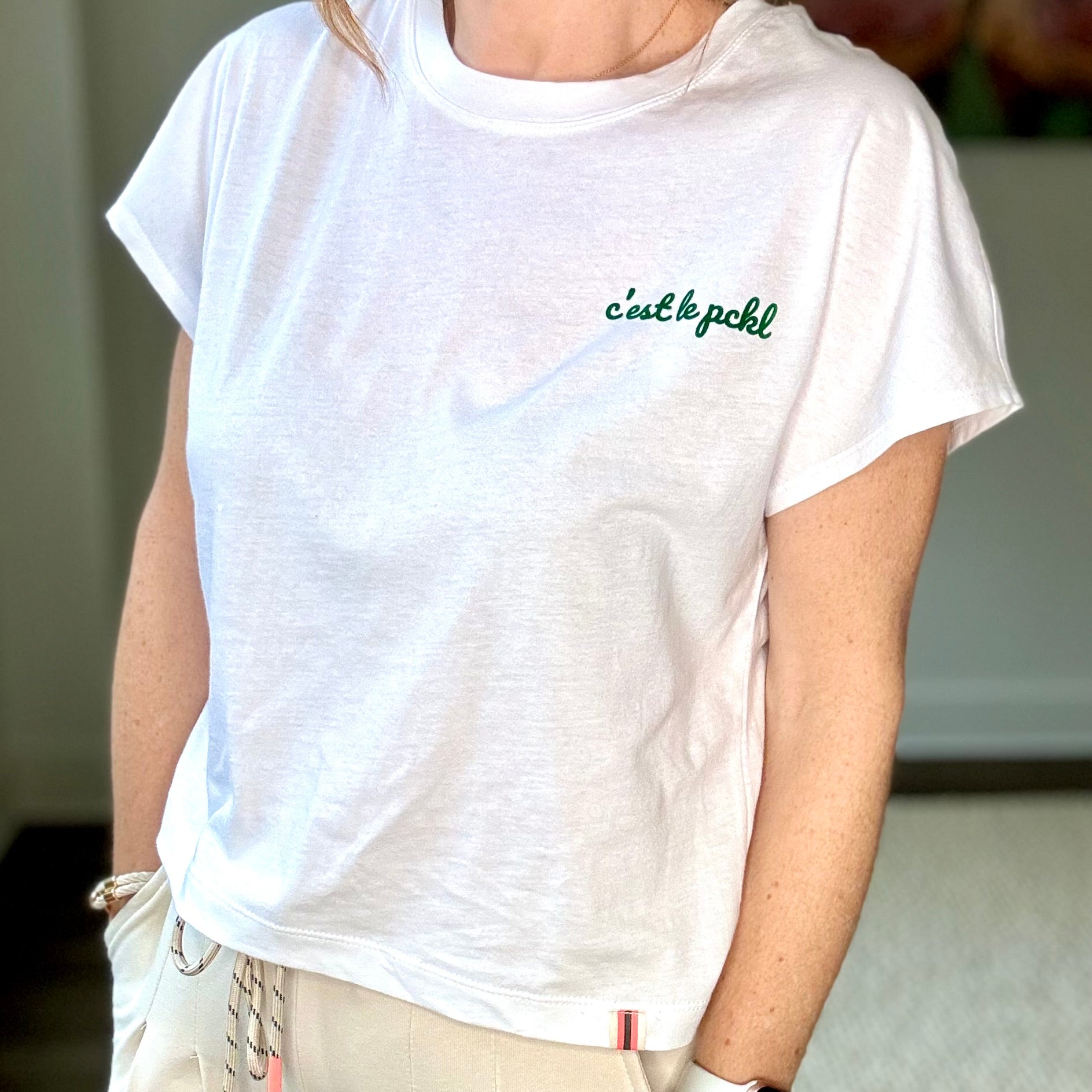 White short sleeve ultra soft t-shirt with green c'est le pickleball left chest graphic