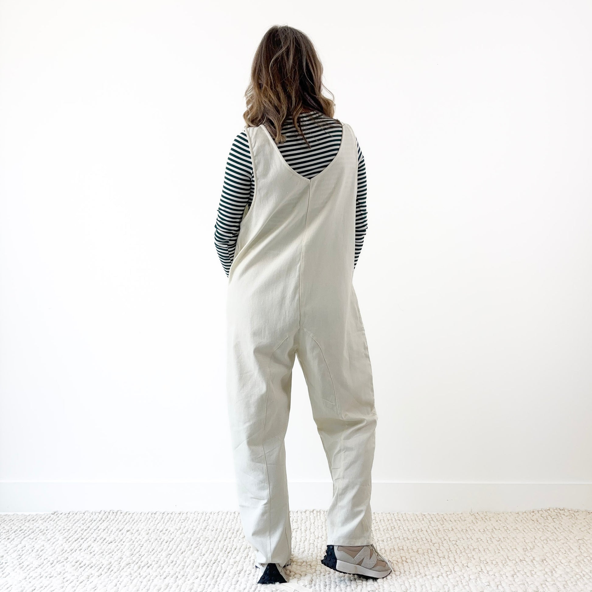 Women's Ivory Front Seam Pull on woven jumpsuit with front pockets