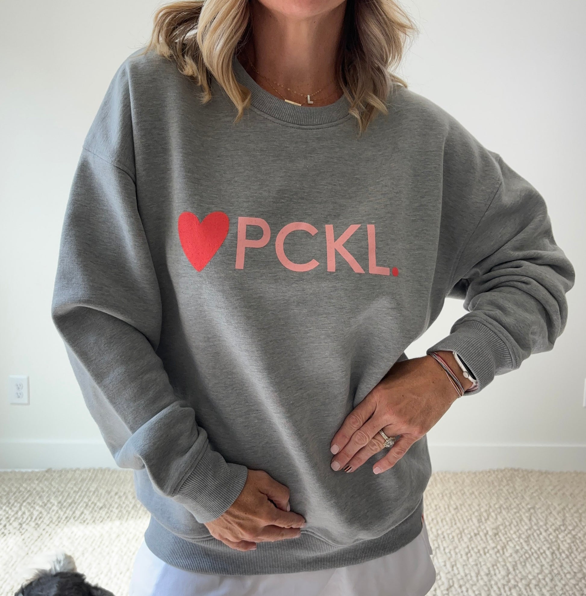 Women's heather gray classic crewneck fleece sweatshirt with pink heart PCKL pickleball screenprint
