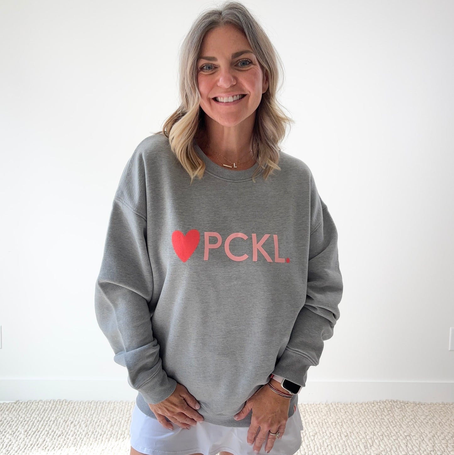 Women's heather gray classic crewneck fleece sweatshirt with pink heart PCKL pickleball screenprint