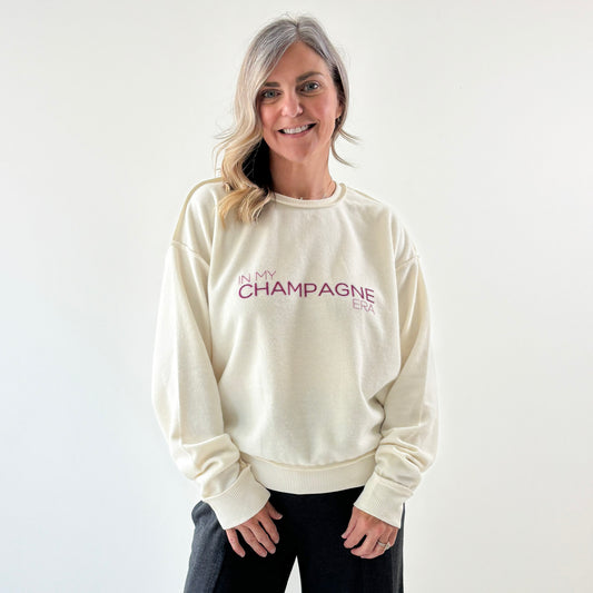 Women's Ivory fuzzy exposed seem crewneck sweatshirt with burgandy In My Champagne Era print
