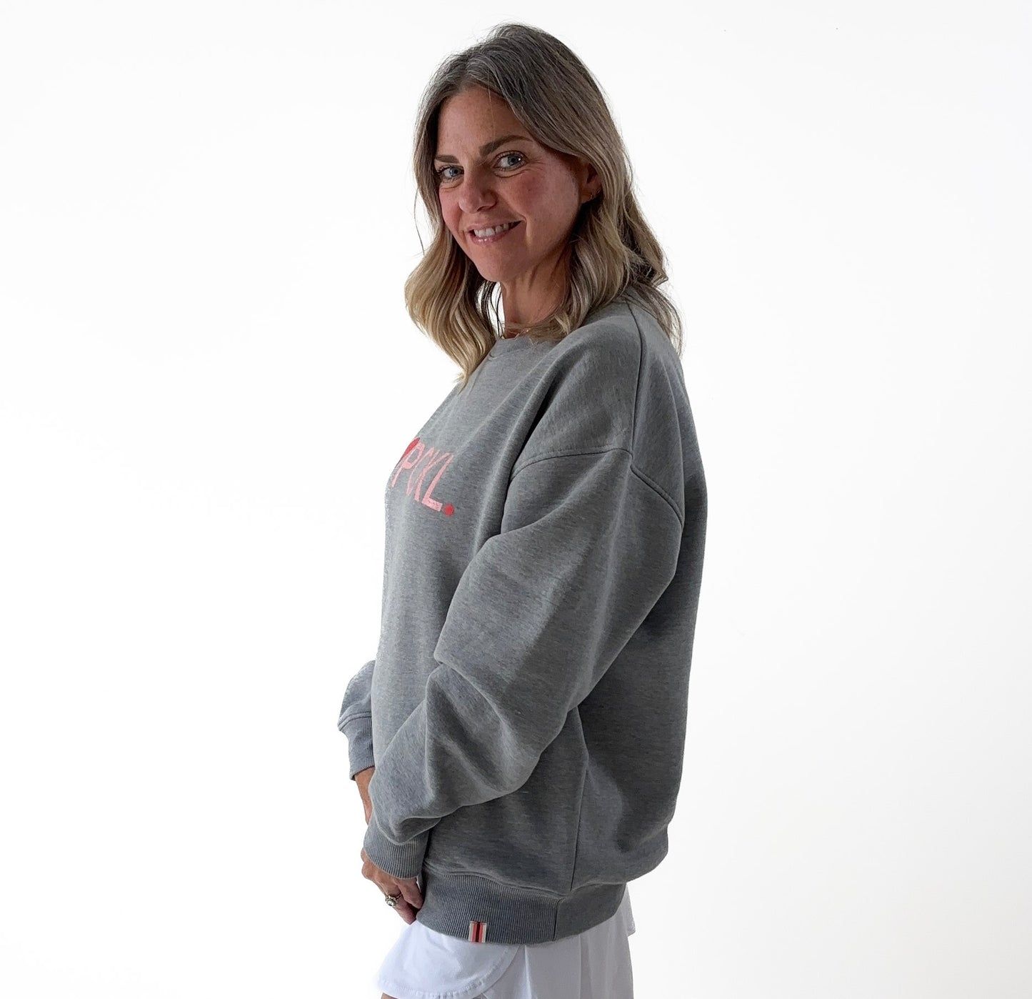 Women's heather gray classic crewneck fleece sweatshirt with pink heart PCKL pickleball screenprint
