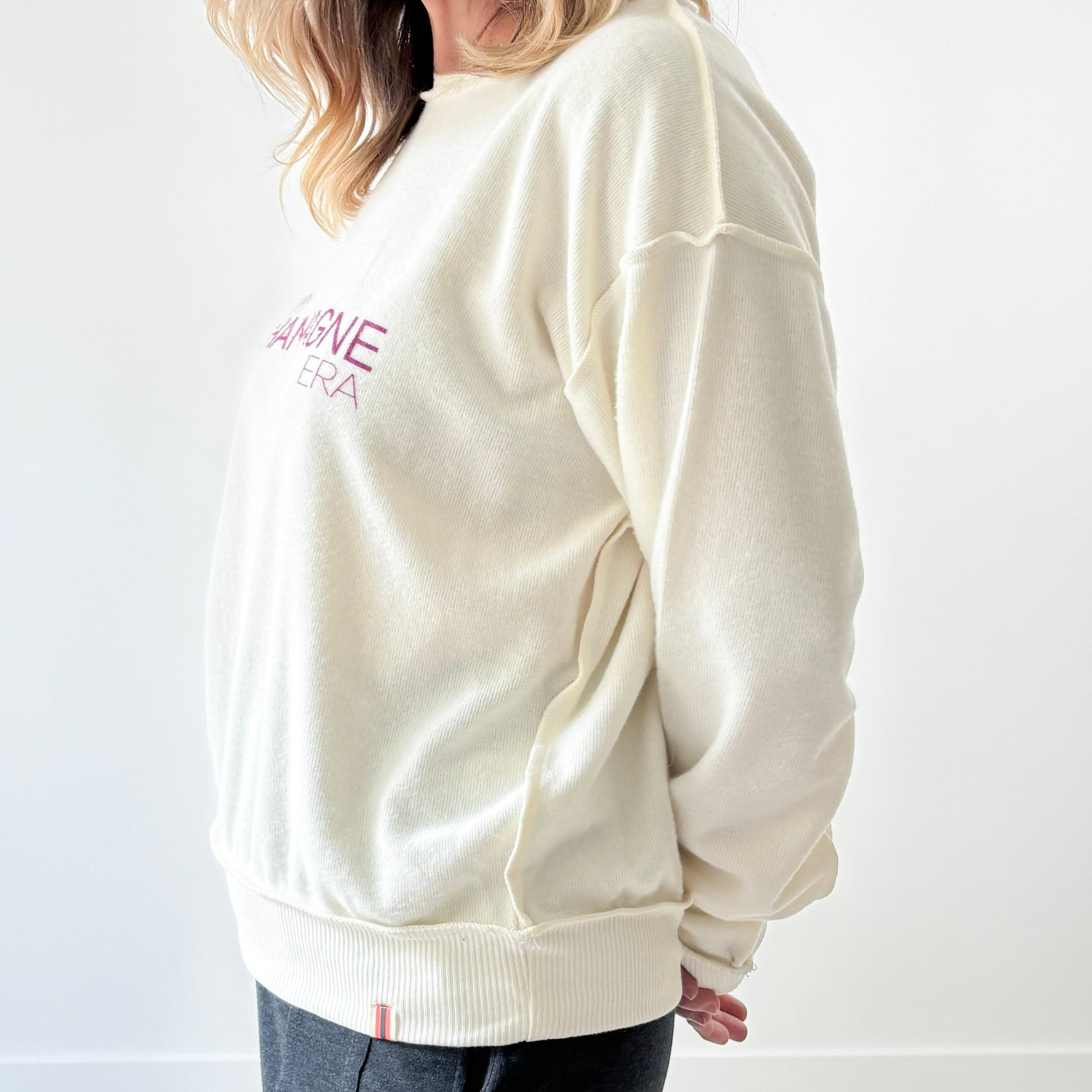 Women's Ivory fuzzy exposed seem crewneck sweatshirt with burgandy In My Champagne Era print