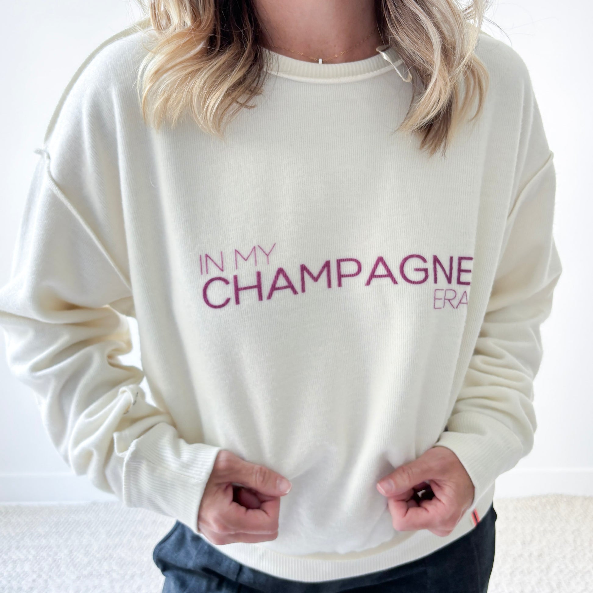 Women's Ivory fuzzy exposed seem crewneck sweatshirt with burgandy In My Champagne Era print
