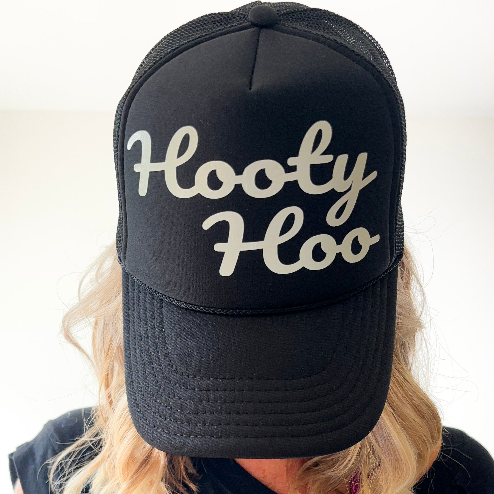 Black mid profile trucker hat with pearl script hooty hoo print