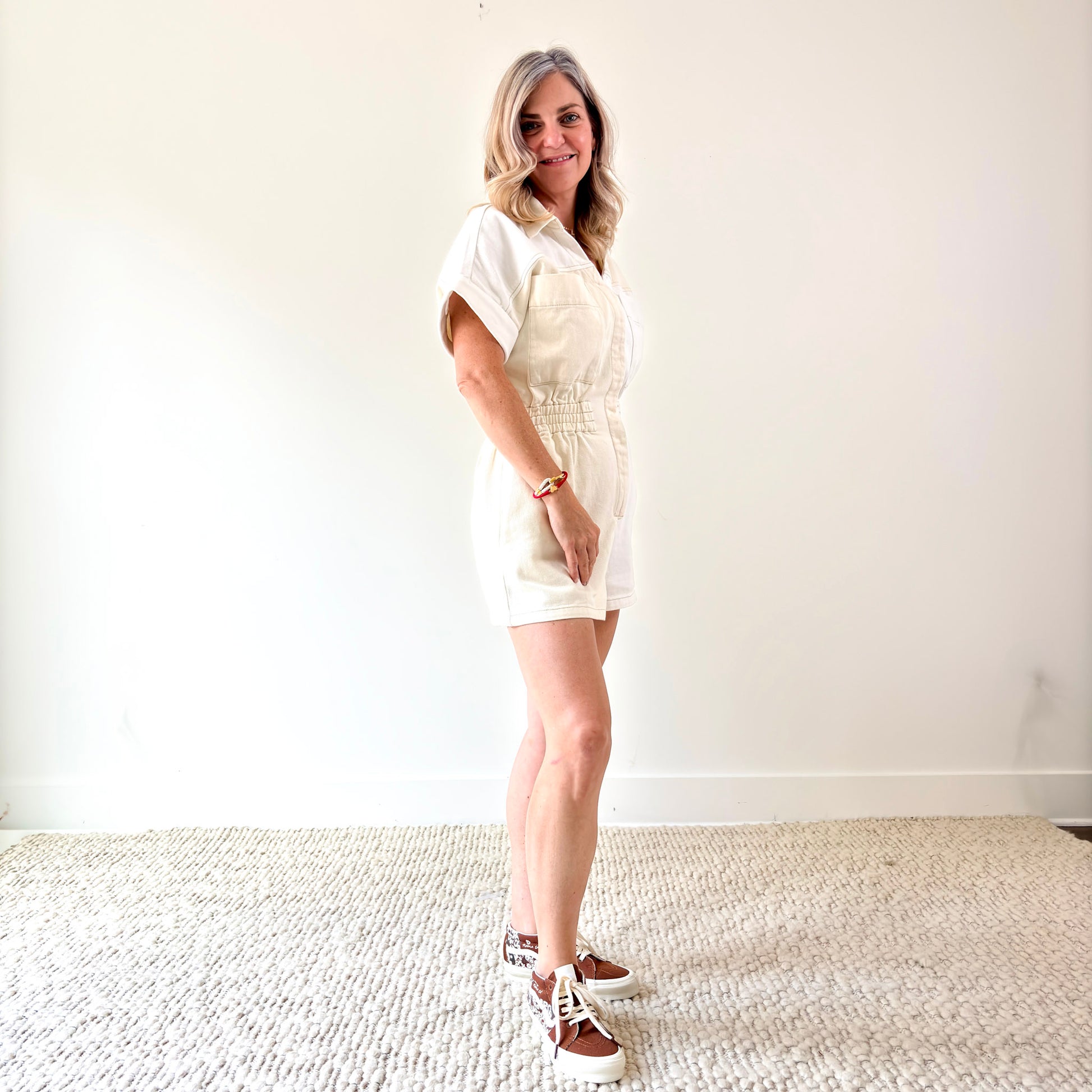 Two tone ivory and white color blocked short romper with pockets and elastic waist