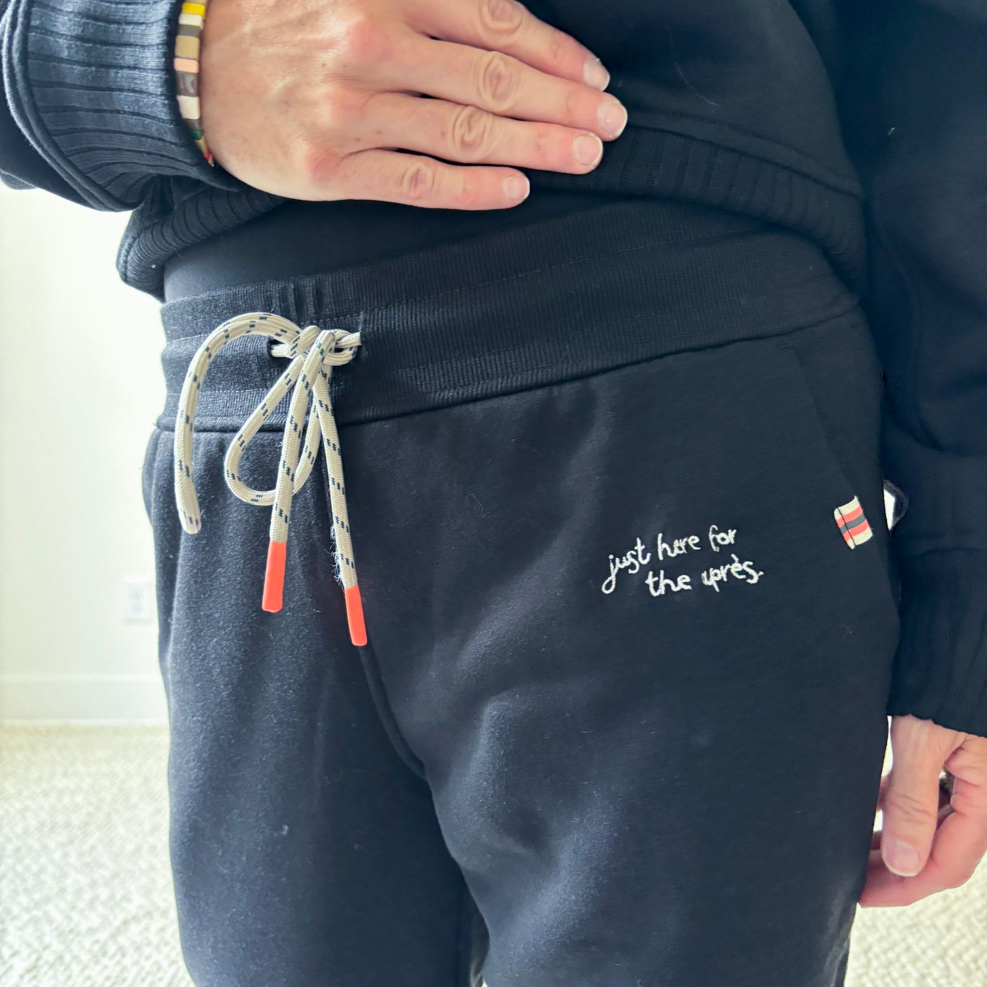 Women's black slim fit fleece jogger with just here for the après embroidery