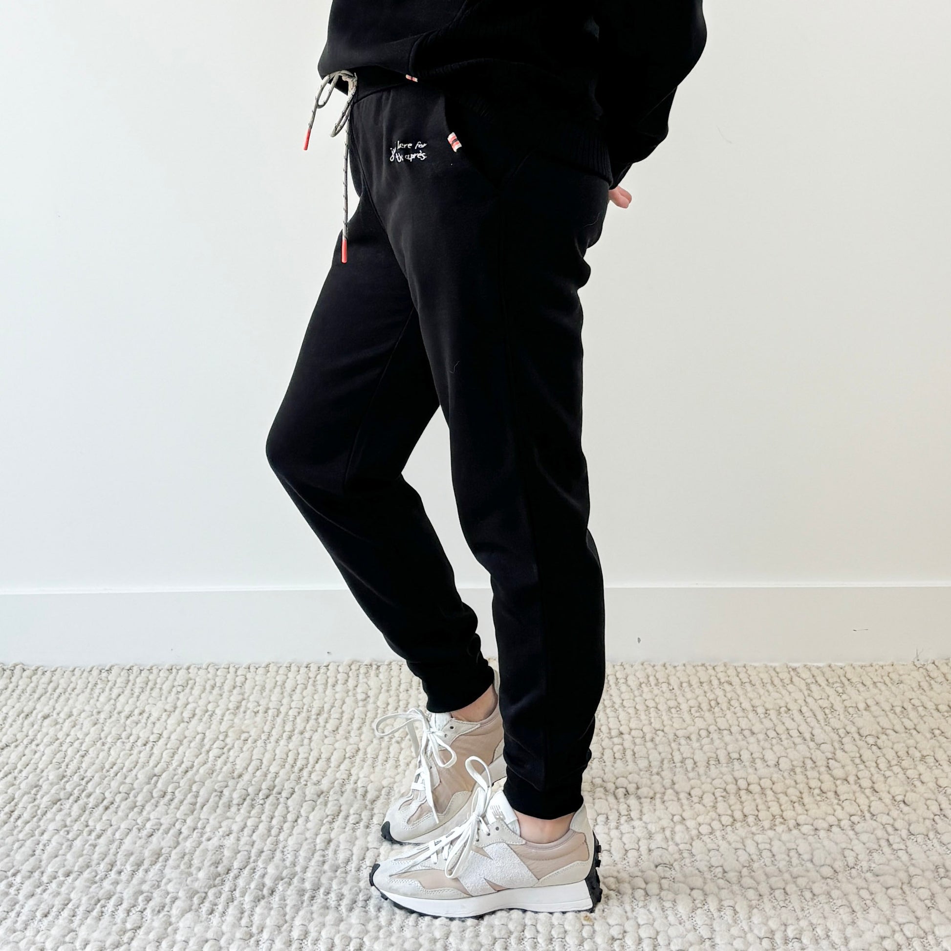 Women's black slim fit fleece jogger with just here for the après embroidery