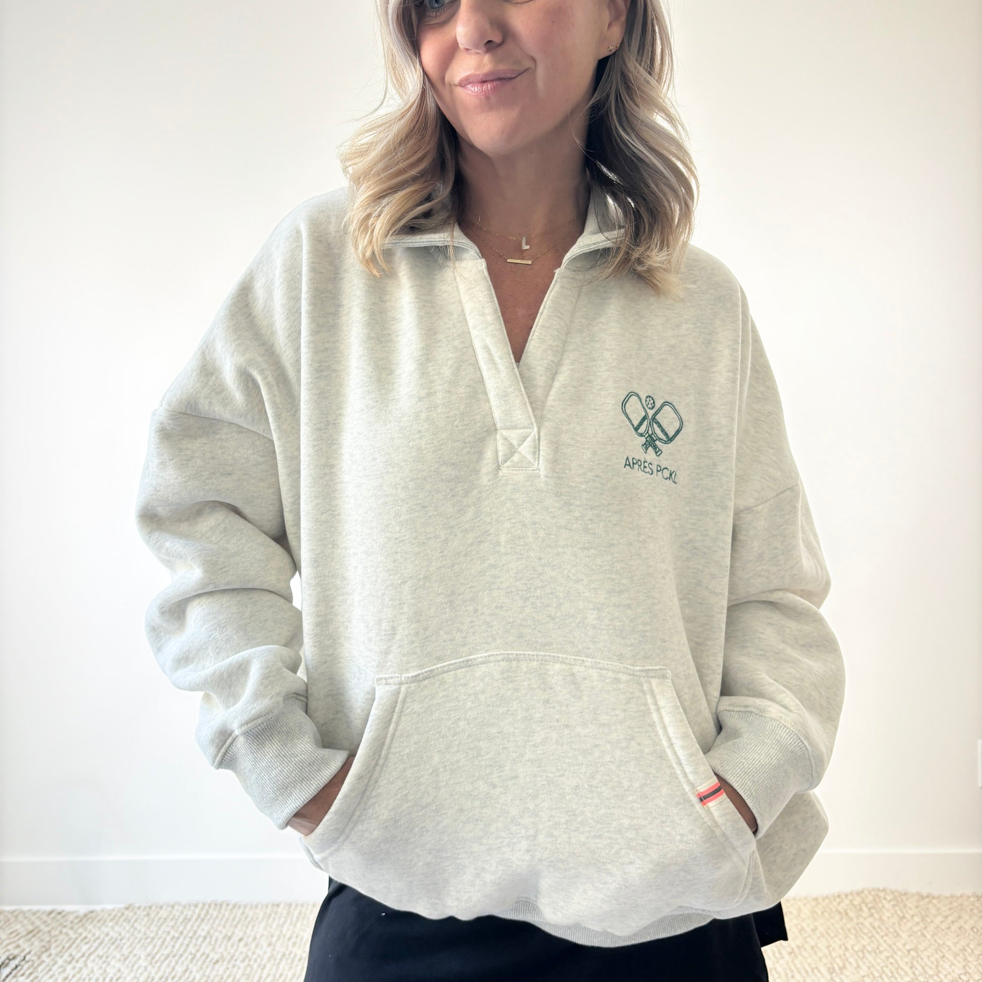 Heather oatmeal oversized collared sweatshirt with après pckl pickleball paddle embroidery