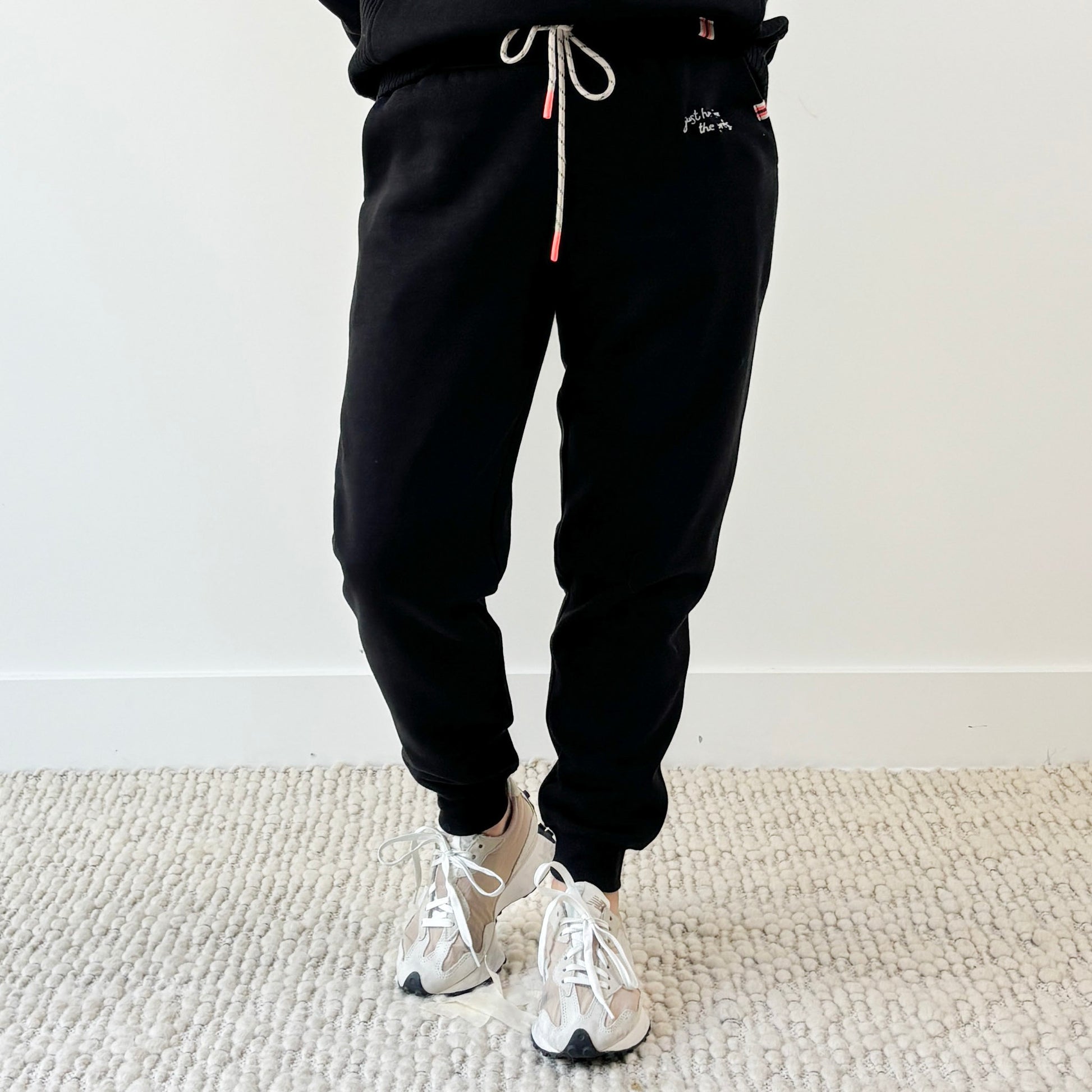 Women's black slim fit fleece jogger with just here for the après embroidery