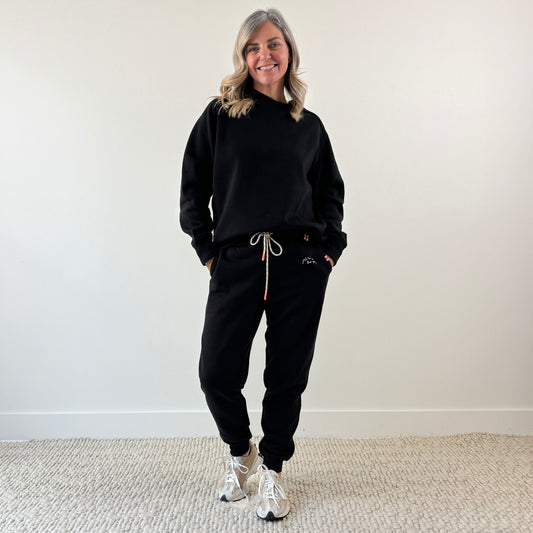 Women's Black Cozy Fleece Rib inset Crewneck Sweatshirt and Women's black slim fit fleece jogger with just here for the après embroidery