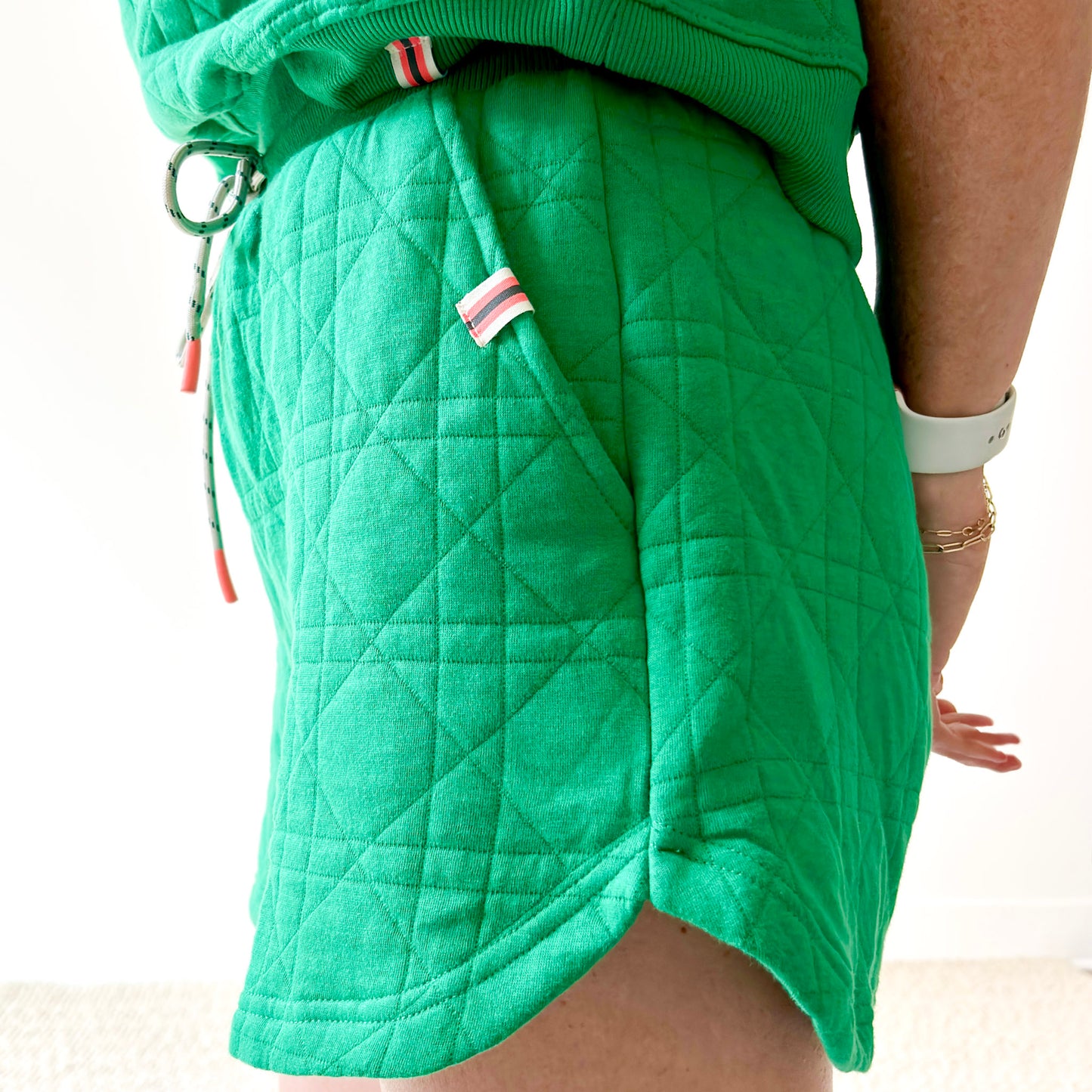 Women's kelly green textured pull on short with pockets and drawcord