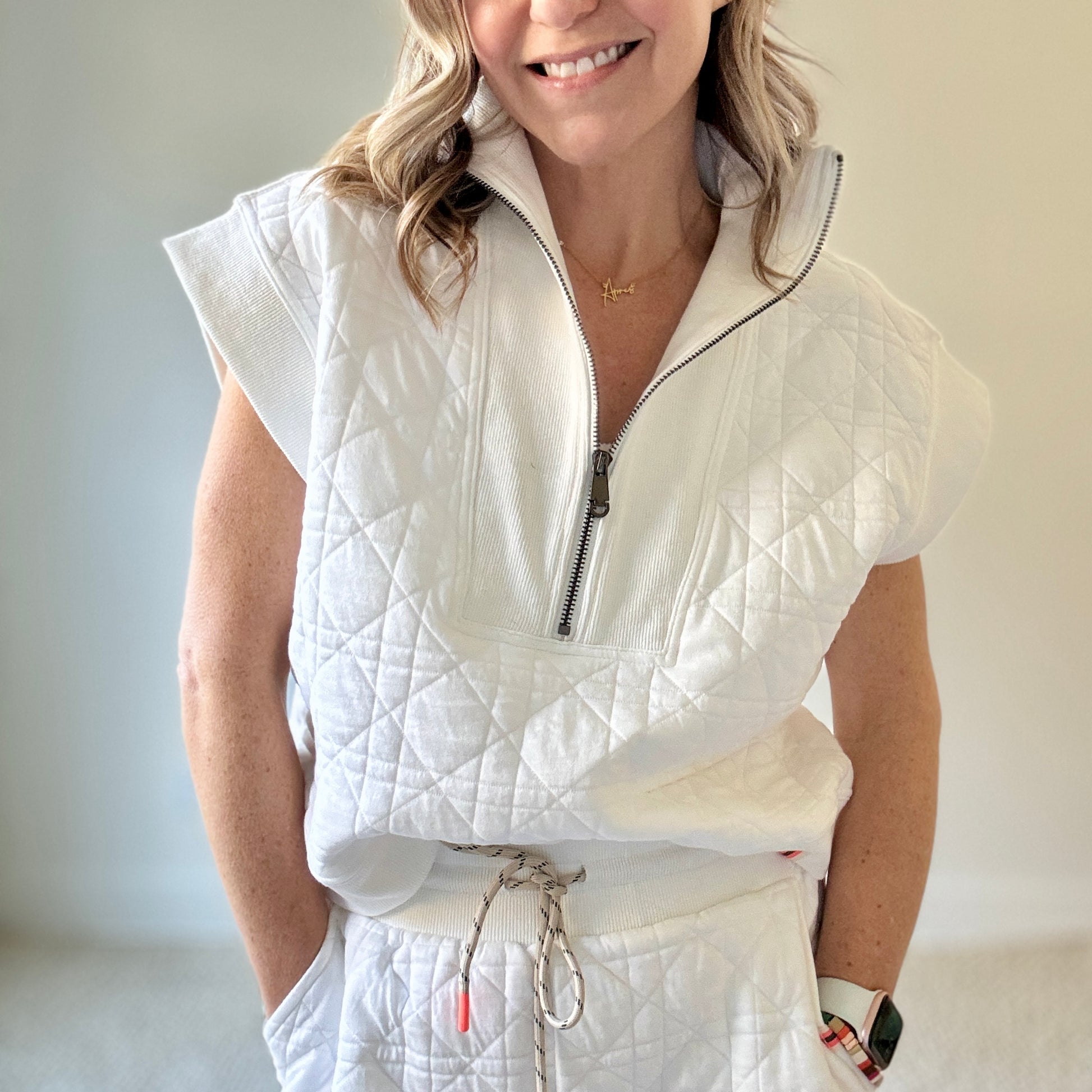 Women's preppy white textured quarter zip top with ribbed trim