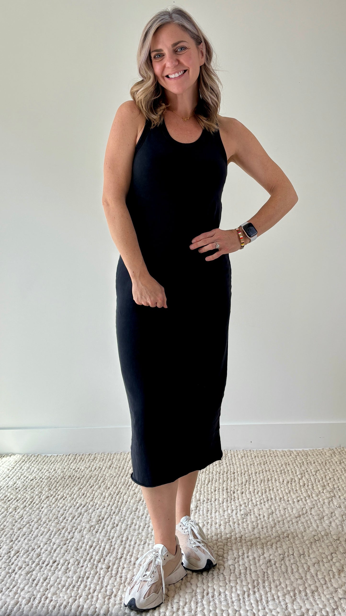 Women's black knit tank racerback fitted midi dress with raw hem