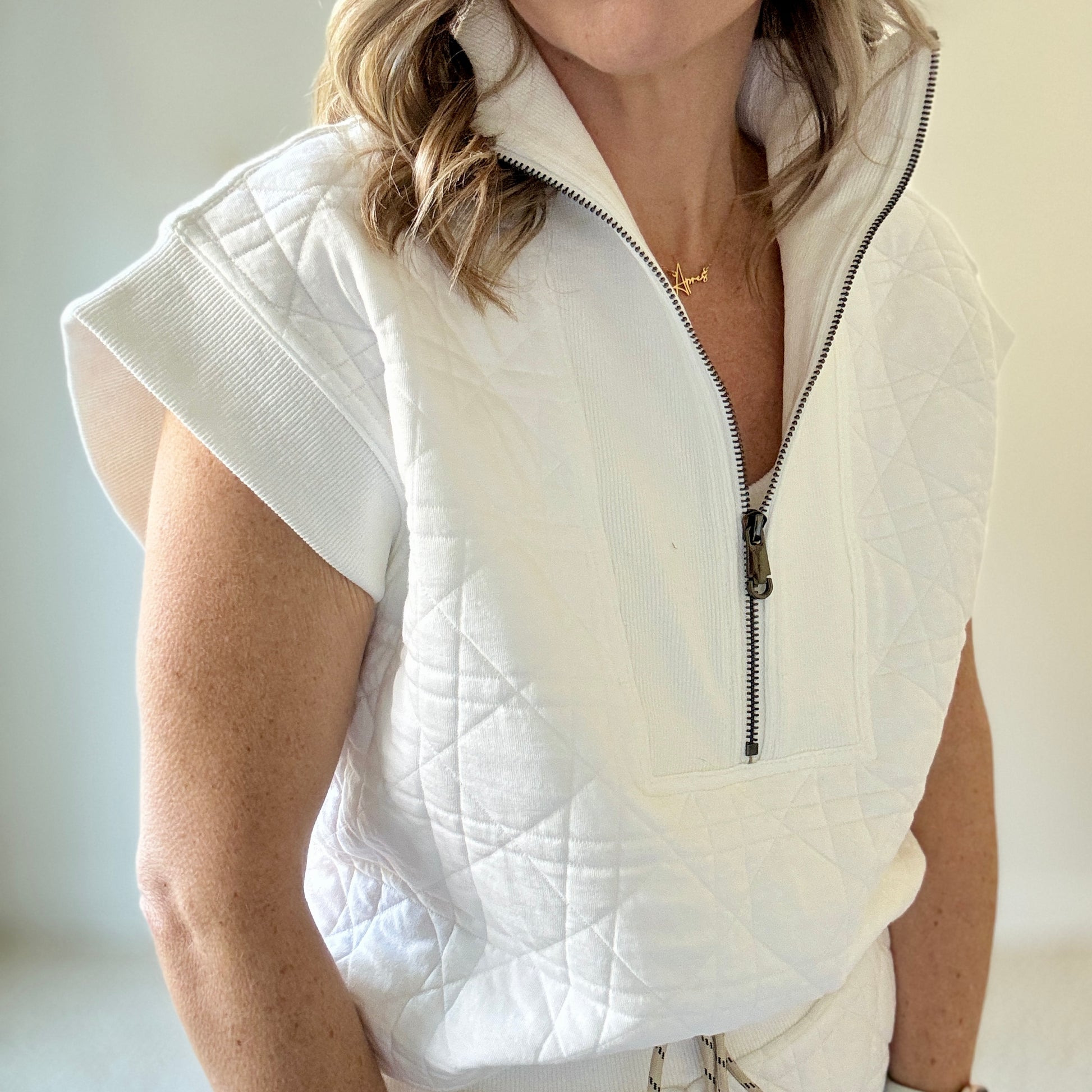 Women's preppy white textured quarter zip top with ribbed trim