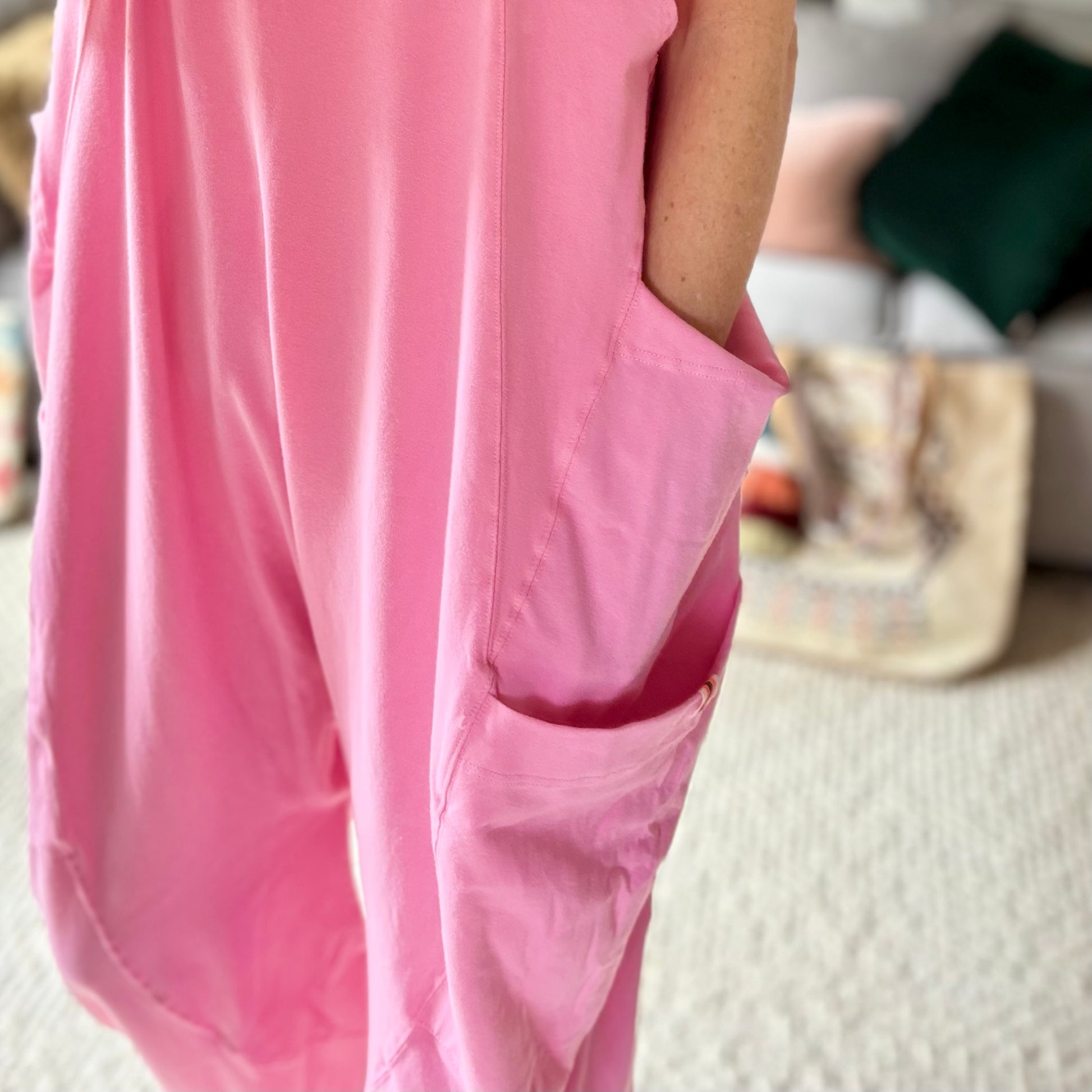 Women's Pink Knit Tank jumpsuit romper with cargo pockets side ties and gathered elastic hem