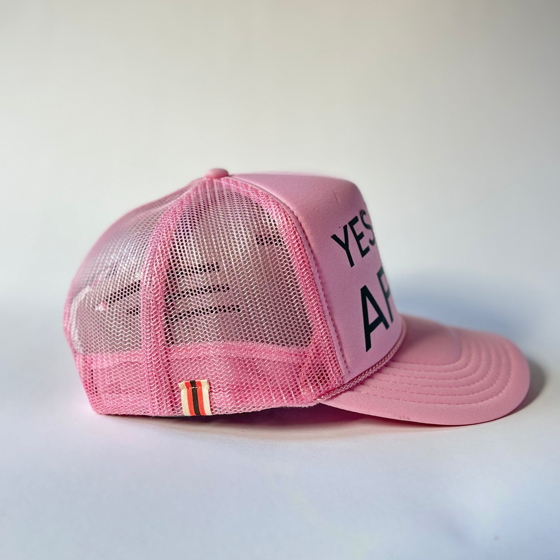 Light Pink High Profile Trucker Hat with dark green yes way apres print